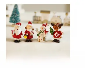 Miniature Christmas resin figurines set featuring Santa Claus, reindeer, and snowman decor