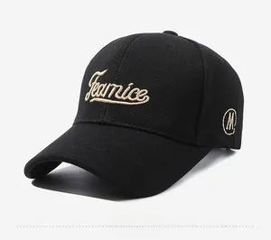 Detail of black baseball cap featuring Gearnice cursive embroidery and side M logo