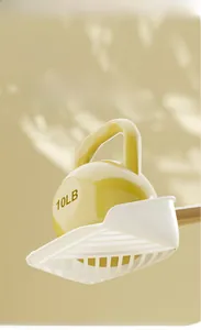Detail showing the heavy-duty white plastic cat litter shovel supporting a 10LB weight