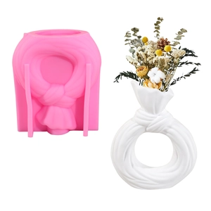 Molde de silicona DIY para jarrón con forma de nudo y ejemplo de yeso blanco