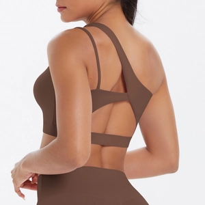 Detail of the brown one-shoulder sports bra with an asymmetric hollow back design