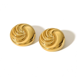 Detail view of 18k gold plated round stud earrings with unique spiral textured finish