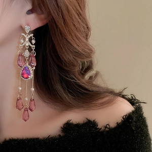 Detail of pink crystal tassel earrings with sparkling rhinestone settings for women