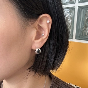 925 silver hoop with black stone, star stud and pearl earrings set on ear