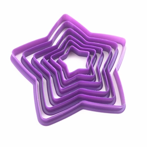 Five-piece set of purple star-shaped plastic cookie cutters for baking and cake decorating