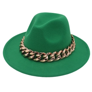 Close-up of emerald green wool fedora hat featuring a chunky gold metal chain detail