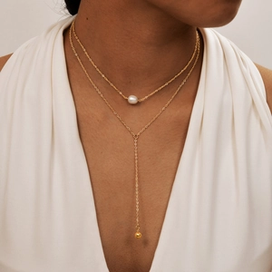 Double-layered gold stainless steel necklace with white pearl and polished ball pendant