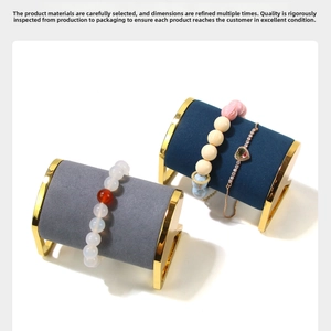 Detail of elegant beaded bracelets and heart pendant chain on luxury velvet jewelry stands