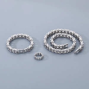 Polished stainless steel bike chain jewelry set including bracelet, ring, and necklace