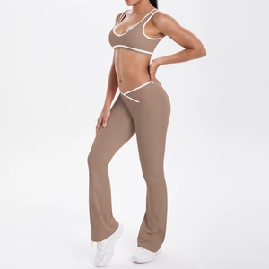 Detail view of mocha high-waisted flare yoga pants with white crossover waist and matching top