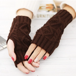 Dark brown cable knit fingerless gloves for men and women on white wooden background