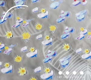 Detail of translucent floral nail stickers with blue and yellow oil painting patterns