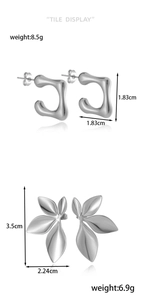 Detail display of silver geometric hoop earrings and leaf studs with size and weight specs