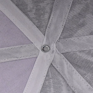 Macro shot of plaid baseball cap interior featuring metal rivets and reinforced webbing