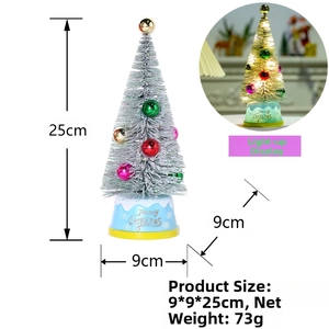 Mini lighted Christmas cedar tree with colorful ornaments on a blue Merry Christmas base