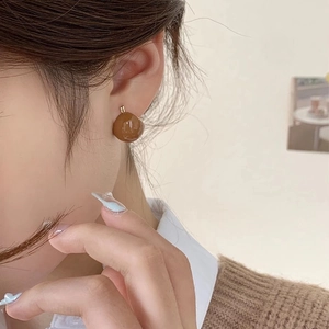 Elegant vintage dark brown glazed oval stud earrings with a glossy minimalist design