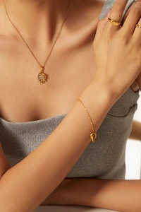 Golden 18K plated stainless steel necklace set with sun moon pendants and crystal accents