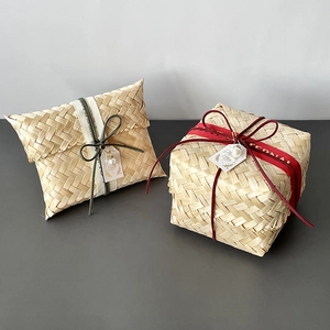 Handmade bamboo gift boxes with silk ribbons and pearl tags in square and pillow shapes