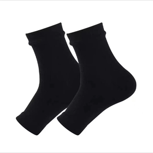 Pair of black rib-knit open-toe ankle compression sleeves for sports on white background