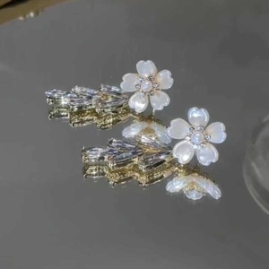 Silver flower tassel earrings with white petals and clear zircon leaf-shaped accents