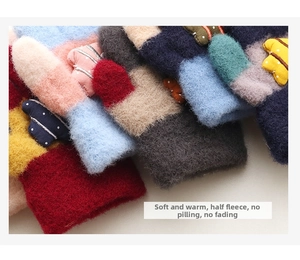 Close-up of thick chenille knit gloves for kids featuring soft textures and colorful designs