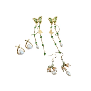Elegant floral pearl earring set with butterfly tassels and lily of the valley designs