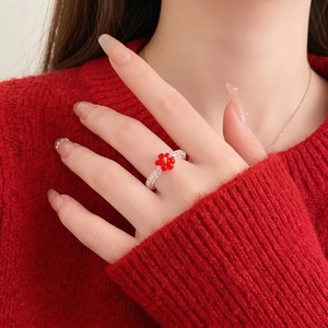 Handmade beaded flower ring with white beads and a red floral accent for women