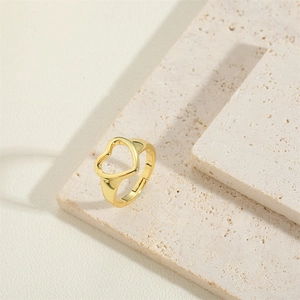 Minimalist gold heart-shaped open ring featuring a polished finish on stone surface