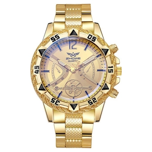 Detail view of gold men's quartz watch with blue-tinted dial and steel link bracelet