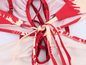 Detailed view of red and beige coconut tree print fabric with back tie-up design