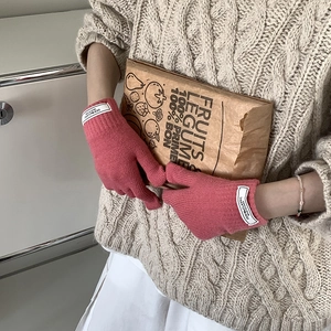 Pink knit touchscreen gloves for women featuring warm thick material and ribbed cuffs