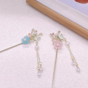 Elegant Chinese hair pins with pink flowers, blue butterflies, and golden tassels