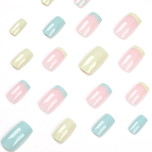 French tip press-on nails in macaron yellow, blue, and green pastel shades