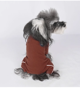 Detail showing deep brown velvet warm four-legged pet onesie with white stripe accents