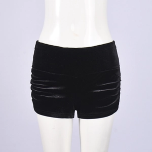 Detailed view of black velvet high-waisted shorts with side ruched elastic design