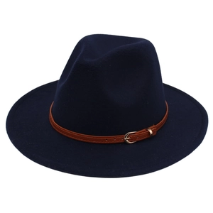 Detailed close-up of navy wool fedora hat featuring a brown leather band and gold buckle