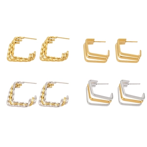 Three-layer twisted C-shape earrings in gold and silver finish with 18k plating