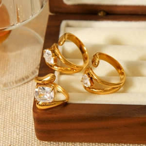 Adjustable gold rings with zircon stones in a wooden jewelry box luxury presentation