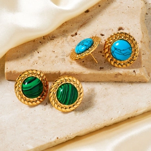 Detail of green malachite and blue turquoise button earrings with gold braided edges