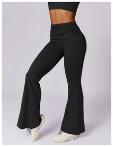 Detail of high waist flared yoga pants with ruched waistband and slim fit silhouette