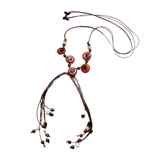 Bohemian woven wood bead necklace with resin pendant and ethnic tassel in brown tones