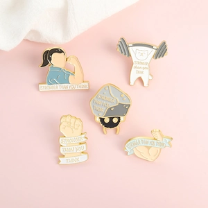 Creative enamel pins set featuring fitness cat and stronger than you think text motifs