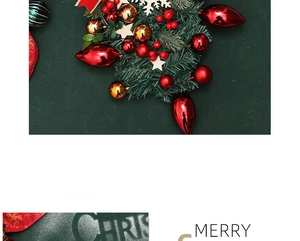 Close-up of red and gold Christmas ornaments with festive pine needles and wooden stars