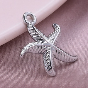 Macro shot of 304 stainless steel starfish pendant showing detailed metal texture