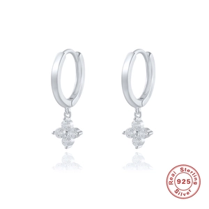 Close-up of S925 sterling silver hoop earrings with zircon clover charms on white background
