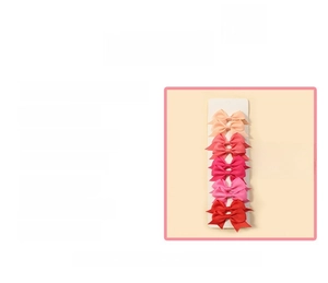 Detailed view of 5-piece layered bubble flower hair clips set in pink and orange tones