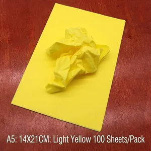 Detail of A5 light yellow tissue paper showing flat and wrinkled texture for DIY craft
