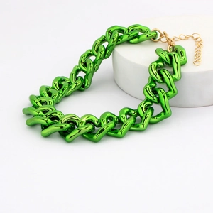 Detail of green chunky acrylic pet chain with golden lobster clasp and glossy finish
