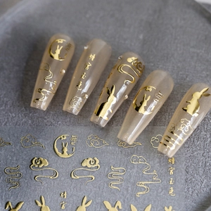 Golden Moon Rabbit nail stickers with traditional clouds on elegant nude base nails