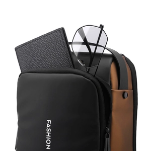 Close-up of waterproof chest bag opening showing storage for wallet and glasses
